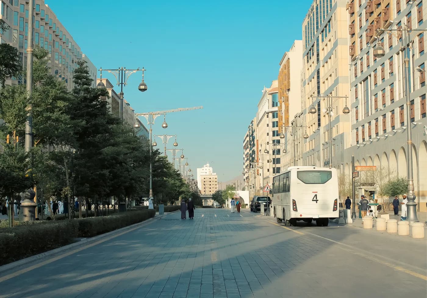Coach travelling along a hotel-lined street in Madinah